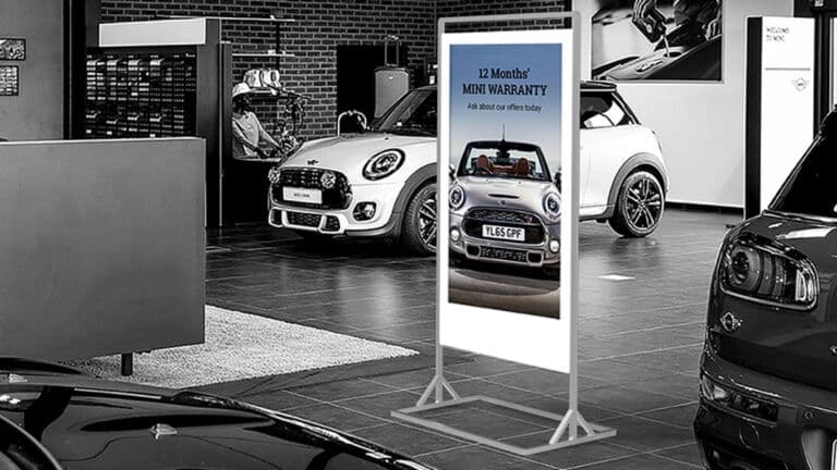 Slimline Freestanding Double Sided Digital Screen in a Car Showroom