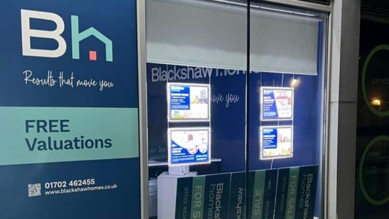 Window vinyl and LED poster pockets outside Blackshaw Homes estate agent